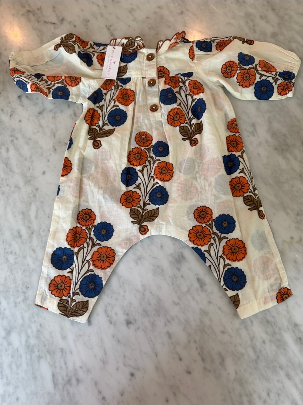 Pink Chicken Cream One-Piece with Blue & Orange Floral Pattern